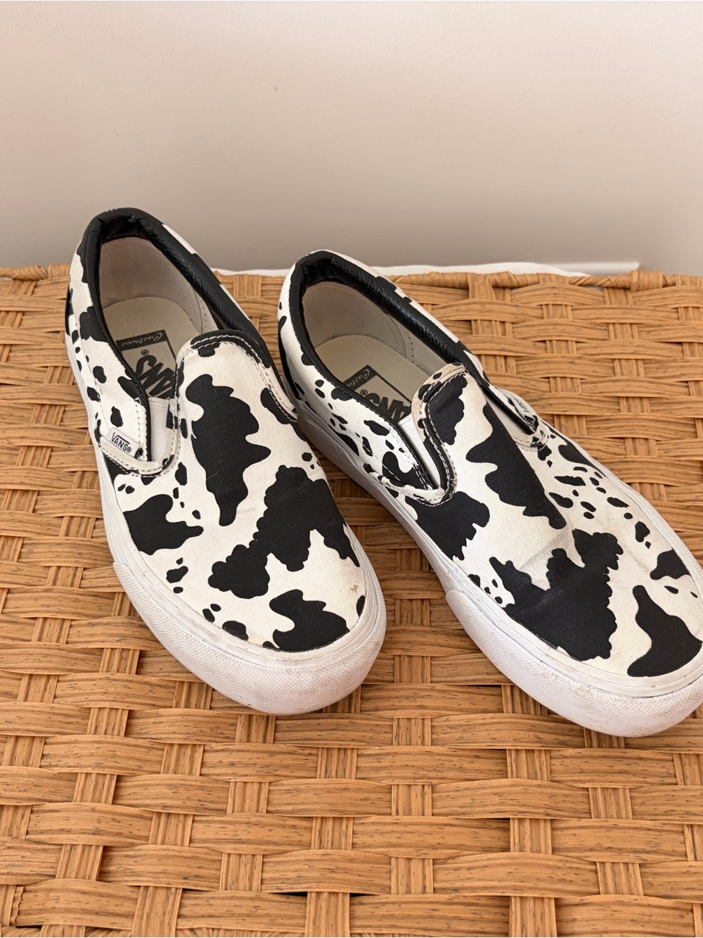 Vans Custom Women’s Slip-On Sneakers in Black and White Cow Pattern